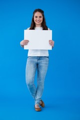 Woman holding a blank placard 