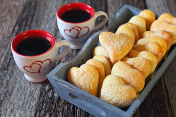 Valentine's Day: two cups of coffee and heart cookies