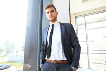 Fototapeta premium Portrait of a businessman looking at the window.
