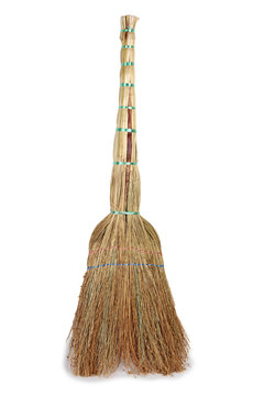 Old broom for cleaning on a white background