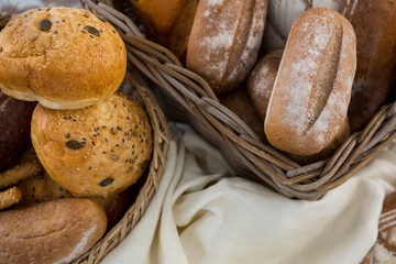 Various types of bread in wicker basket