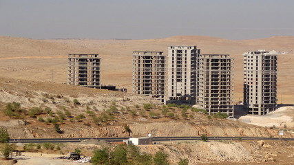 Unfinished high-rise buildings in the desert of northern Iraq © vdw images