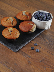 Muffins and a cup with blueberries..