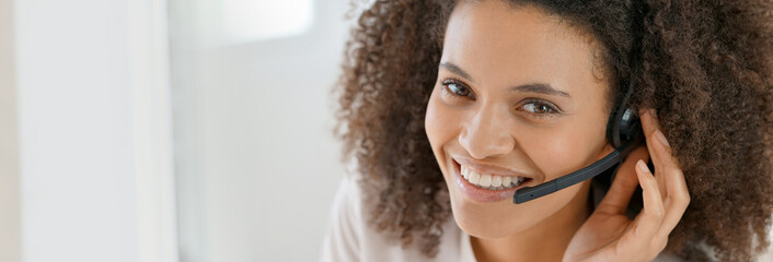 Portrait of customer service assistant talking on phone