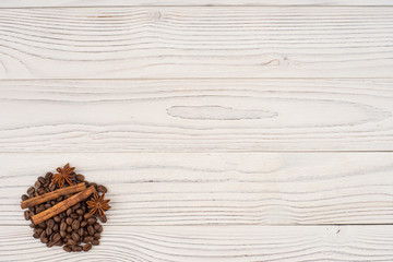 Obraz na płótnie Canvas Coffee with cinnamon on old wooden table.