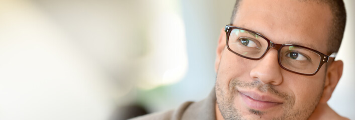 Portrait of hispanic guy with eyeglasses on