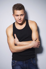 Fototapeta premium Handsome gorgeous young man in shirt indoor smiling