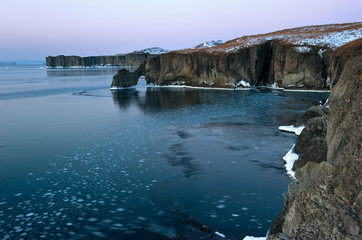The rocky coast of the cold winter morning.