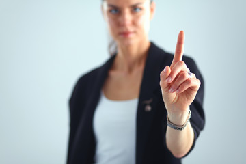 Woman touching an imaginary screen with her finger