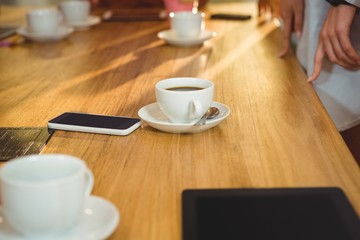 Cup of coffee with smartphone