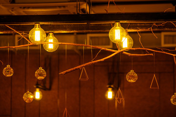 Vintage incandescent lamps as decorative element in a restaurant