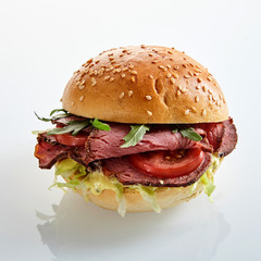 Delicious roast beef burger with salad trimmings