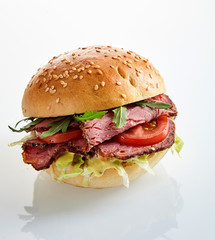 Tasty roast beef or pastrami burger with rocket