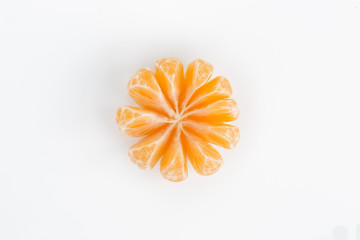 Peeled orange slices mandarin isolated on white background