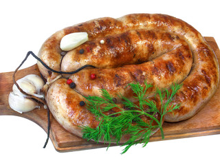 grilled sausage with garlic and dill on a wooden board