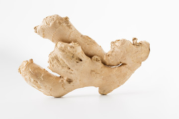 Cute fresh ginger root standing on white background