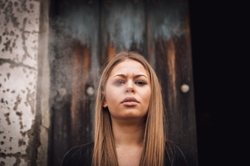 Fototapeta premium Attractive young girl smoking a cigar