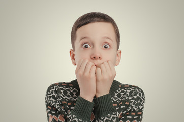Emotions. Shocked boy looking at camera.