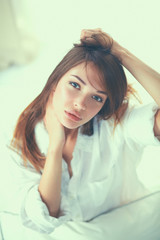 Naklejka premium Portrait of beautiful woman on bed at bedroom