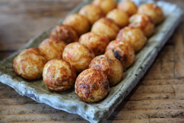 Takoyaki on wood background