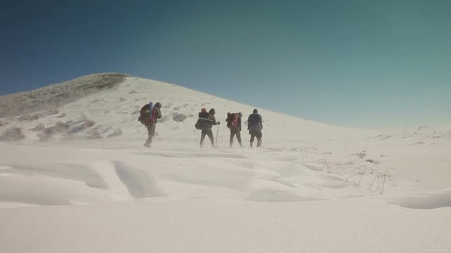The operator takes on the video climbers in the mountains. Indigo color correction