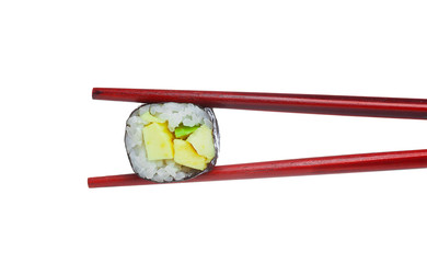 One peace of avocado sushi maki in wooden red chopsticks isolated on white background