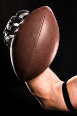 Football player holding ball
