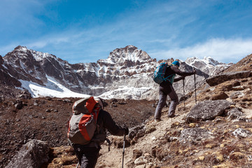 Fototapeta na wymiar Mountain Climbers Team walking up on rocky Terrain