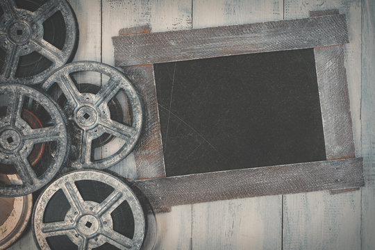 Reels of film and a black board
