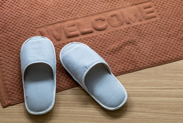 Slippers on Wooden floor with carpet