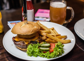 Burger with salad and beer