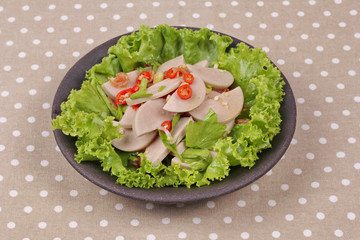 Spicy mixed vegetable salad with sliced Thai white pork sausage