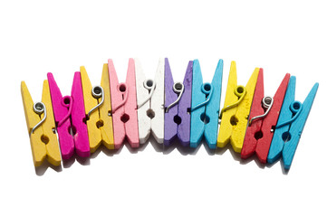 Background of multi colored linen clothespins isolated