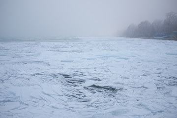 Ice cracks on the surface of a lake © Creaturart