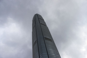 Skyscraper on the background of blue sky  Hong Kong, office building, day. City Business District. High-rise buildings, modern architectural . Glass and concrete.