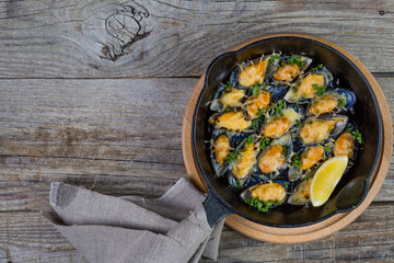 Selection of seafood meal on wood background