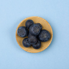 Blueberry on blue table