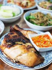 roasted chicken on wood table, thai style