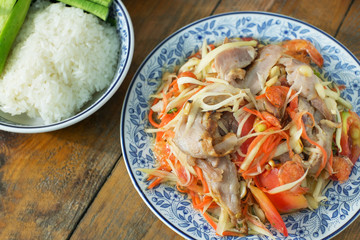 spicy salad with roasted pork and sticky rice