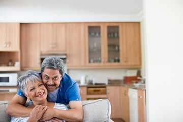 Portrait of senior couple embracing each other