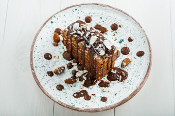 Delicious sweet chocolate Spartak cake on a rustic plate. Haute cuisine dessert. International food. Top view.