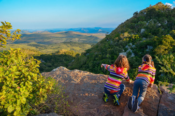 Family travel with children, kids looking from mountain viewpoint, holiday vacation in South...