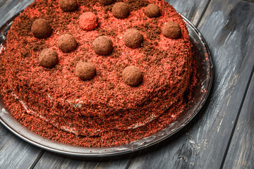 Piece of homemade berry cake on the wood background