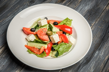 top view of a mixed vegetable salad on ceramic plate
