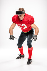 Football player in virtual reality headset