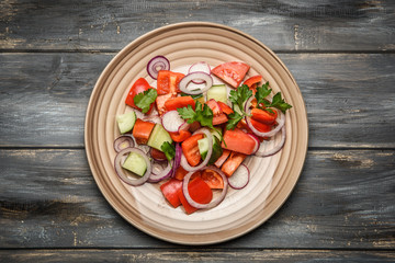 top view of a mixed vegetable salad on ceramic plate