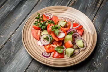 top view of a mixed vegetable salad on ceramic plate