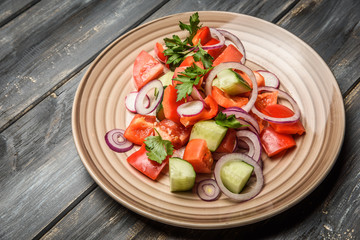 top view of a mixed vegetable salad on ceramic plate