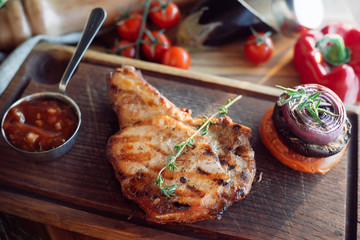 brisket with sauce on a wooden board
