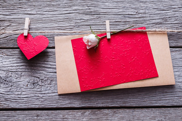 Valentine day background, paper hearts and card on wood